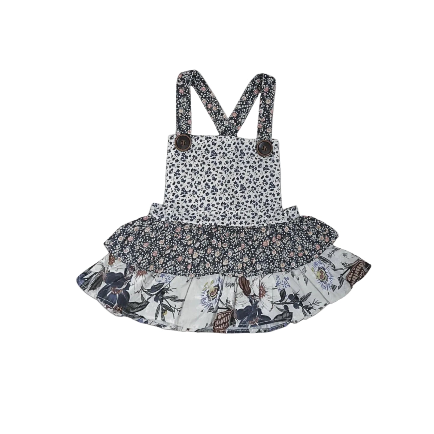 A baby girl's floral and animal print overall dress with shoulder straps, featuring a leopard-print bodice, a ruffled dark floral waistband, and a tiered ruffled skirt with a butterfly and floral print on a light background.