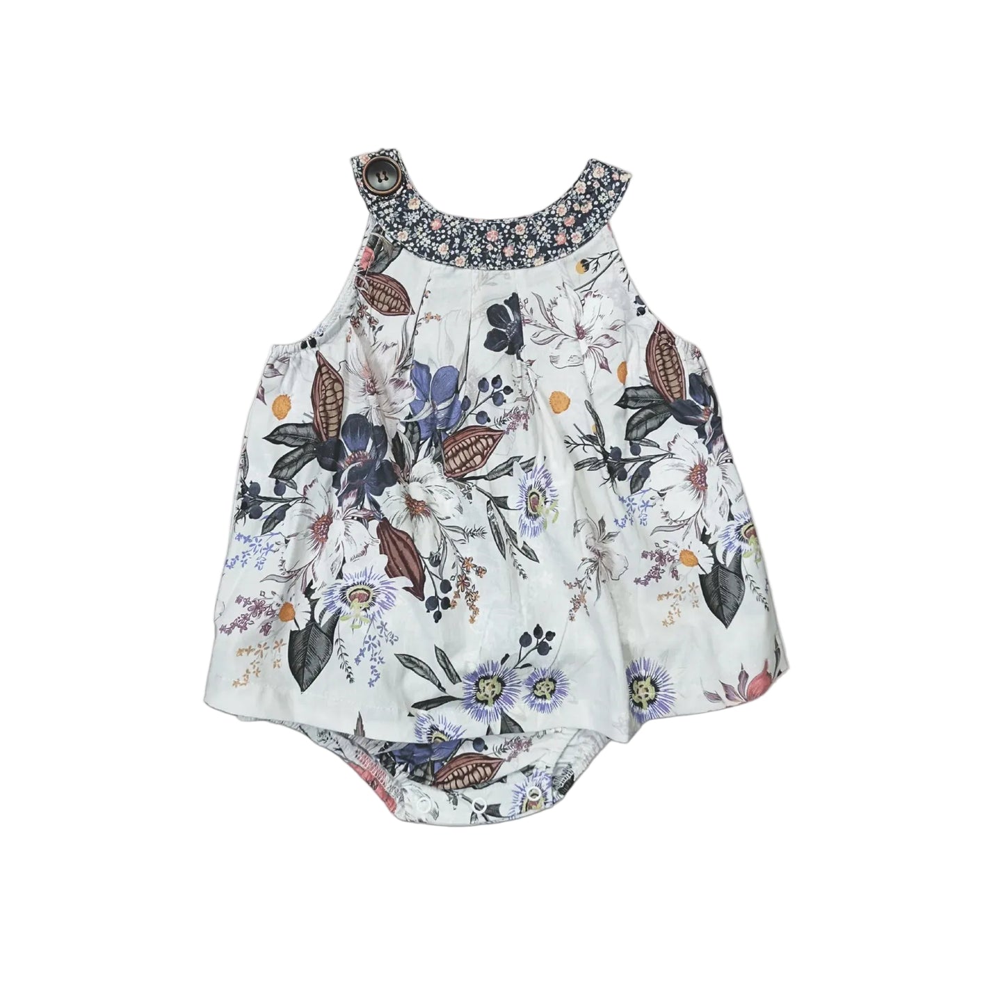 A sleeveless baby romper with a white base and a colorful butterfly and floral print, featuring a patterned floral collar and ruffled shoulder straps, laid flat on a light gray background.