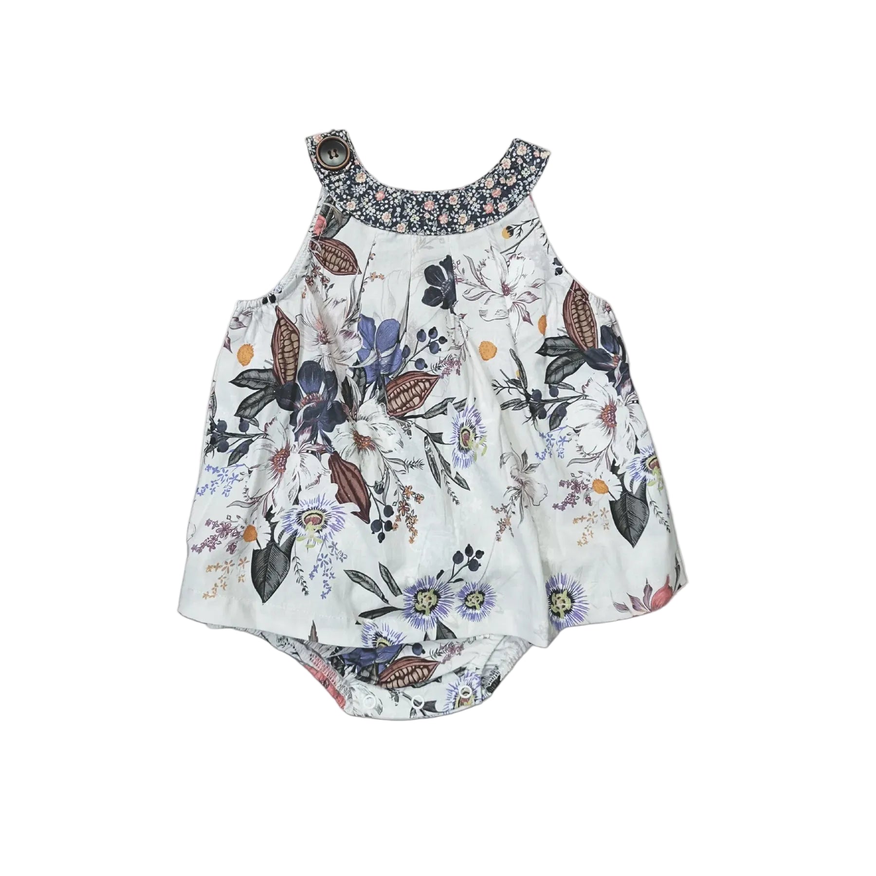 A sleeveless baby romper with a white base and a colorful butterfly and floral print, featuring a patterned floral collar and ruffled shoulder straps, laid flat on a light gray background.