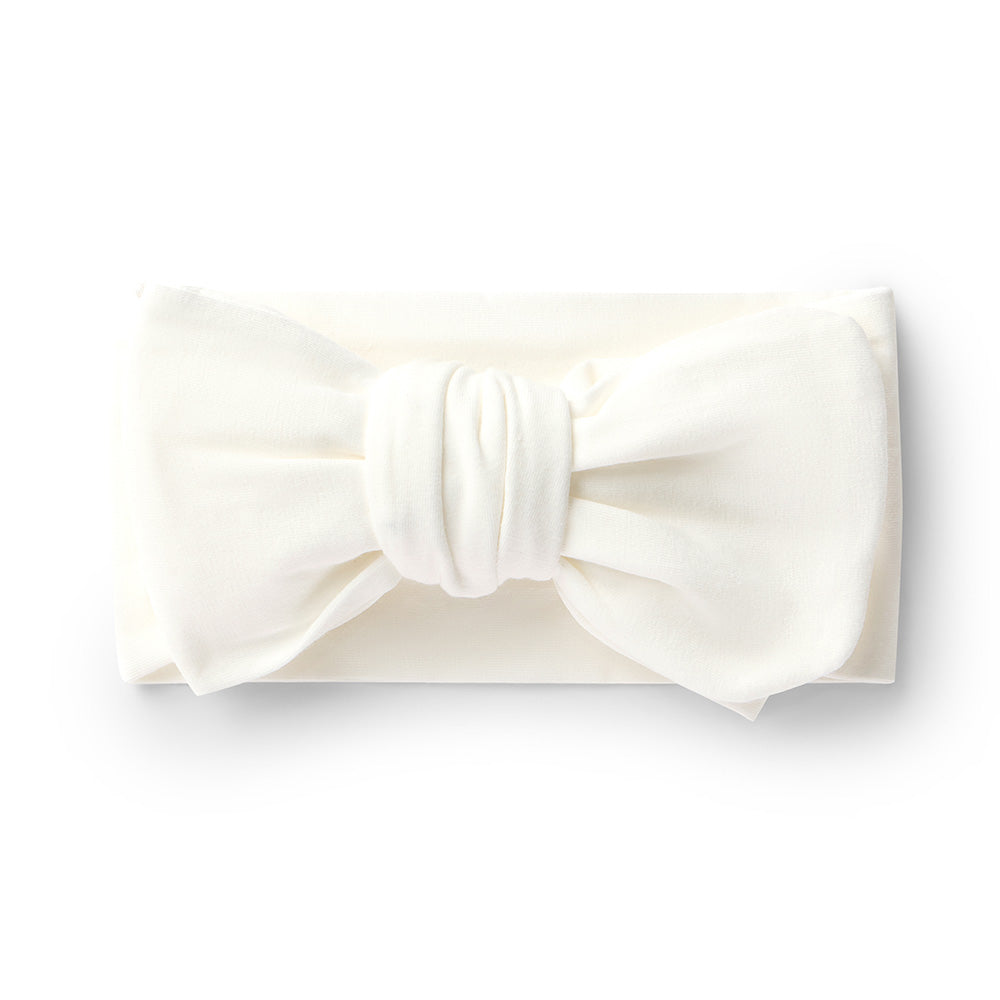 White bow headband on a white background