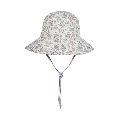 Floral patterned sun hat with a tie on a white background
