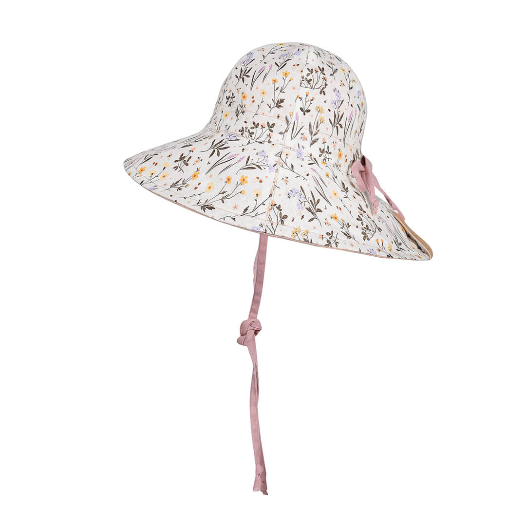 Floral patterned sun hat with a pink strap on a white background