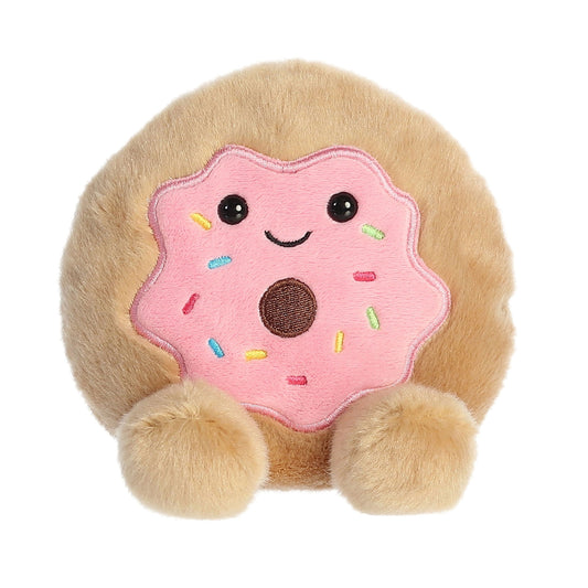 Plush toy shaped like a donut with a smiling face on a white background