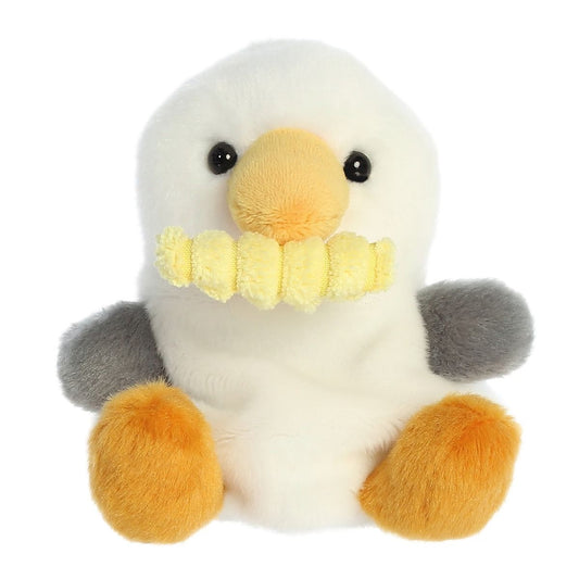 Plush toy penguin with a white body, orange feet and beak, black eyes, and gray wings on a white background.