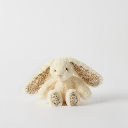 Plush bunny toy with glittery ears and paws on a light gray background