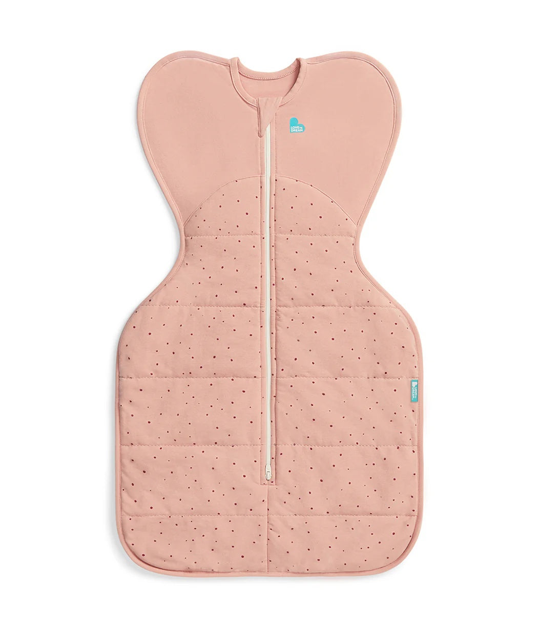 Pink baby wrap with a subtle pattern on a light gray background