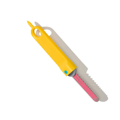 Yellow and pink folding knife on a white background