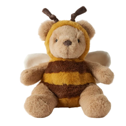 Stuffed toy bear wearing a bee costume on a white background