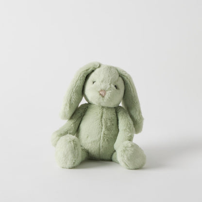 Green plush bunny toy on a white background
