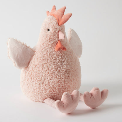 Plush toy chicken on a light gray background