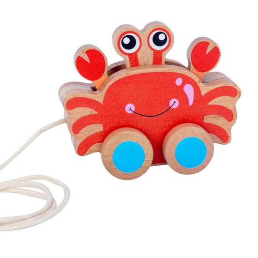 Wooden crab toy with a string on a white background