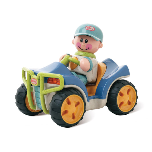 Toy figure of a child driving a toy vehicle on a white background