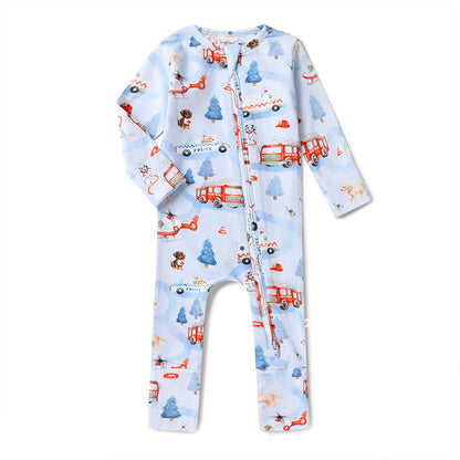Children's onesie with fire truck and airplane pattern on a light blue background