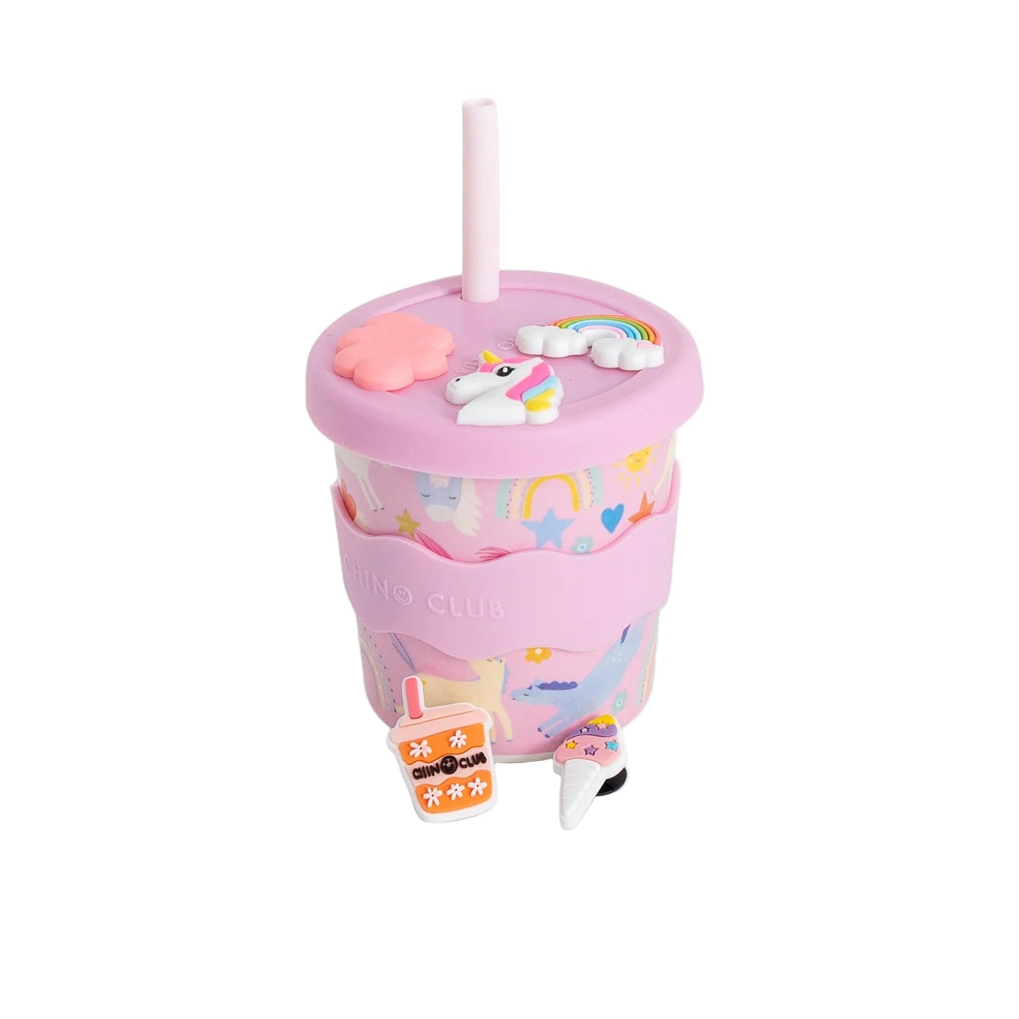 Pink tumbler with unicorn design on a white background