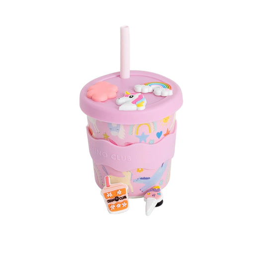 Pink tumbler with unicorn design on a white background