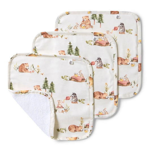 Set of three baby burp cloths with forest animal pattern on a white background